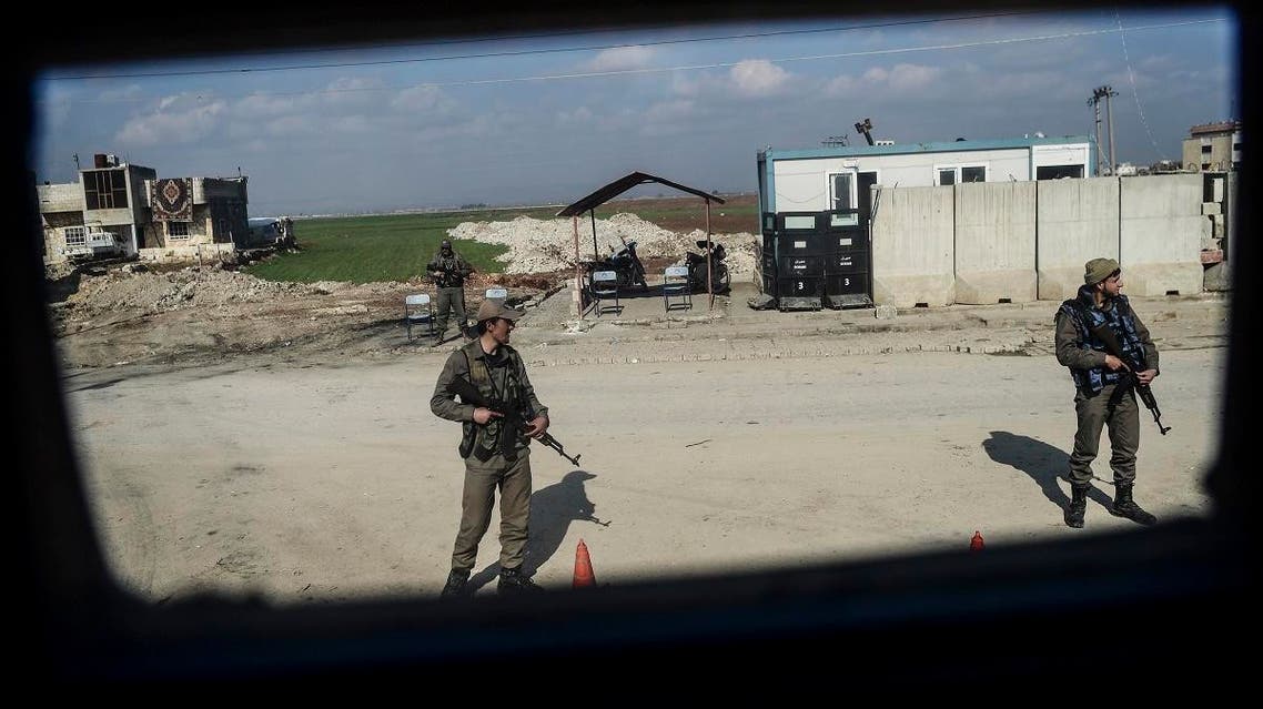 Turkish-backed Syrian rebel fighters stand guard at a checkpoint in the Syrian town of Azaz on a road leading to Afrin, on February 1, 2018. (File photo: AFP)