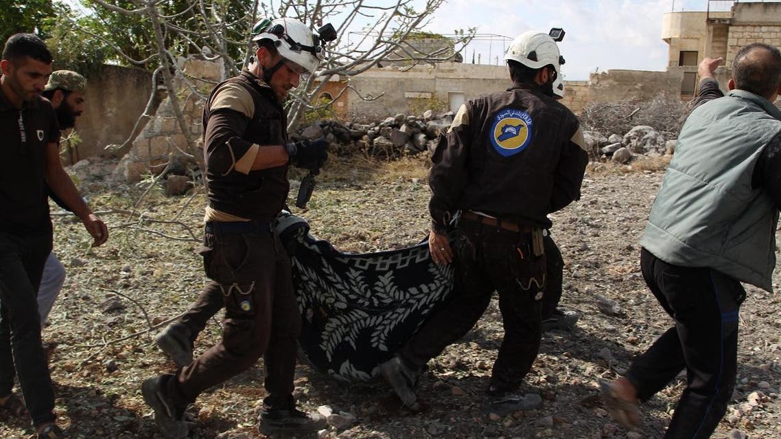 Members of the Syrian Civil Defence (White Helmets) carry away one of the victims of a Russian airstrike that hit the village of Jaballa in the south of the Idlib region on November 2, 2019. (AFP)