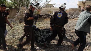 Members of the Syrian Civil Defence (White Helmets) carry away one of the victims of a Russian airstrike that hit the village of Jaballa in the south of the Idlib region on November 2, 2019. (AFP)