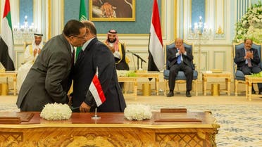 Representatives of Yemen's government and southern separatists embrace each other after signing a Saudi-brokered deal to end a power struggle in the southern port of Aden, in Riyadh. (Reuters)