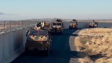 Turkish army armoured vehicles arrive near the Turkish town of Idil at the Turkey-Syria border before Turkish and Russian troops conduct their third joint patrols in northeast Syria, Friday, Nov. 8, 2019. (AP)