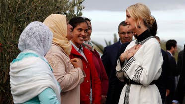 Ivanka Trump, the daughter and senior adviser to President Donald Trump, right, reacts as she listens to women farmers including Aicha Bourkib, second from left, and Fatiha Hamman, in red, in the province of Sidi Kacem, Morocco, Thursday, Nov. 7, 2019, 