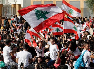 Student protesters wave their national flags as they protest against the government in front of the education ministry in Beirut, Lebanon, Friday, Nov. 8, 2019. (File photo: AP)