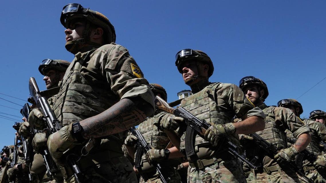 Servicemen of the "Azov" regiment take part in a parade to mark the 5th anniversary of city's liberation from the Russia-backed rebels, on June 15, 2019 in Mariupol. Evgeniya MAKSYMOVA / AFP