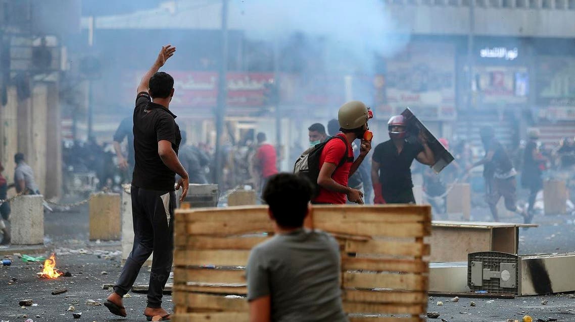 Iraqi riot police fire tear gas to disperse anti-government protesters during ongoing protests in central Baghdad, Iraq, on November 9, 2019. (AP)