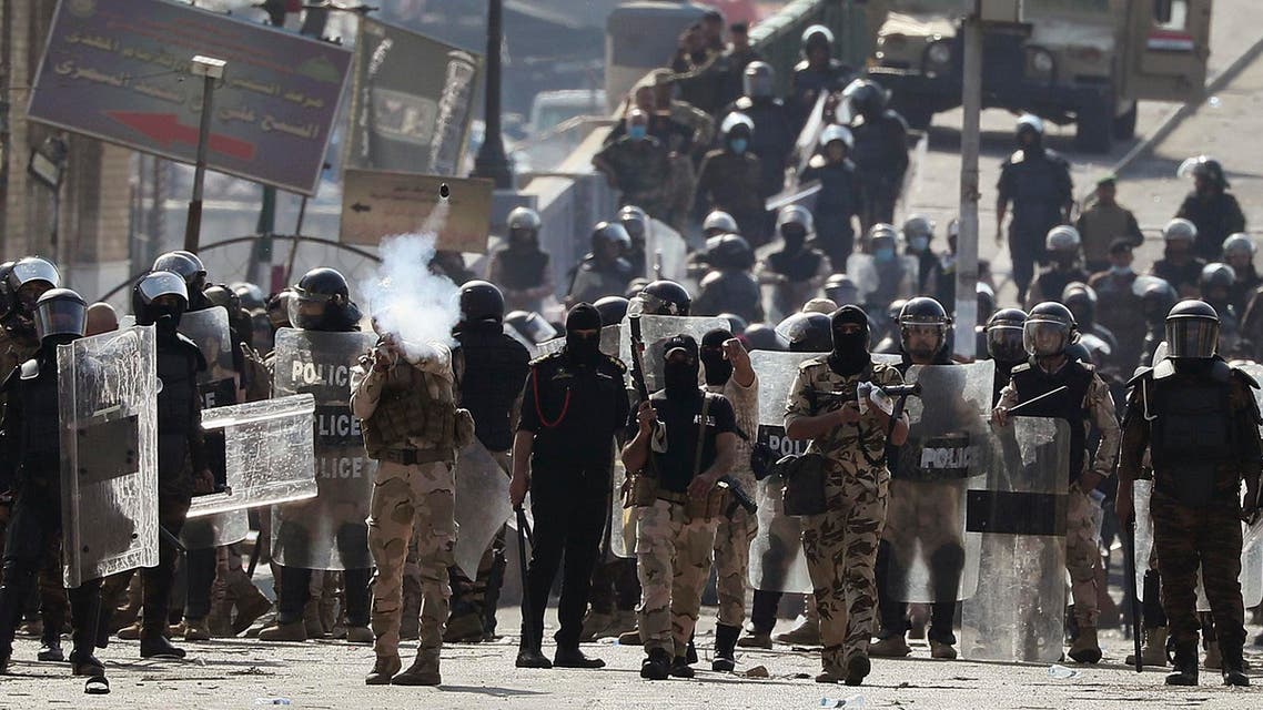 Iraqi riot police fire tear gas to disperse anti-government protesters gathering on the al- Shuhada (Martyrs) bridge in central Baghdad, Iraq, Thursday, Nov. 7, 2019. (AP)