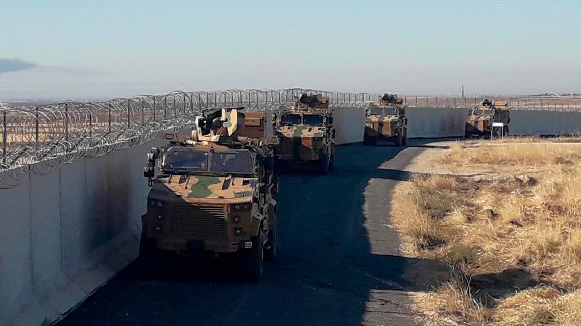 Turkish army armored vehicles arrive near the Turkish town of Idil at the Turkey-Syria border before Turkish and Russian troops conduct their third joint patrols in northeast Syria, on November 8, 2019. (AP)