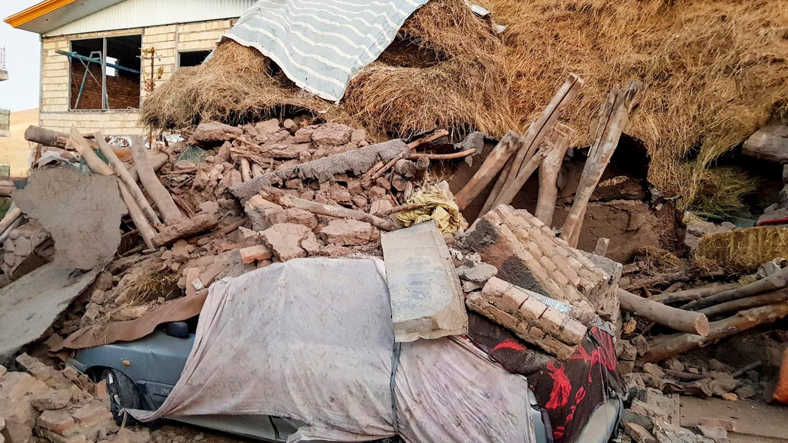 A car lays smashed by debris from an earthquake in Varankesh village in Eastern Azerbaijan province, some 250 miles (400 kilometers) northwest of the capital Tehran, Iran, Friday, Nov. 8, 2019. (AP)