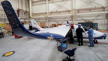 Technicians work on NASA's first all-electric plane, the X-57 Maxwell, at NASA’s Armstrong Flight Research Center at Edwards Air Force Base, California, US, on November 8, 2019. (Reuters)