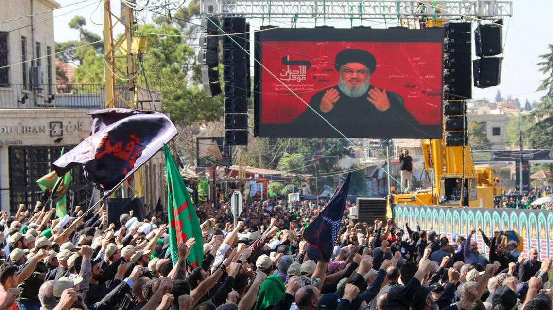 Hezbollah supporters watch a televised speech by Hassan Nasrallah, during a religious festival in Baalbeck in Lebanon’s eastern Bekaa Valley on October 19, 2019. (AFP)