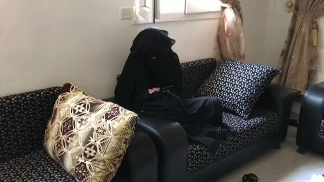 Screengrab of one of the three French women typing on her phone where she was interviewed in Suluk town in Syria. (Thomson Reuters)