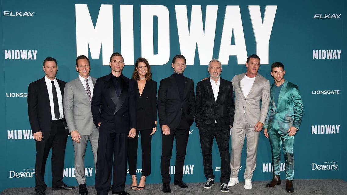 (L-R) Aaron Eckhart, Patrick Wilson, Ed Skrein, Mandy Moore, Luke Kleintank, Roland Emmerich, Luke Evans, and Nick Jonas attend the premiere “Midway” at Regency Village Theatre on Nov. 05, 2019 in Westwood, California. (AFP)
