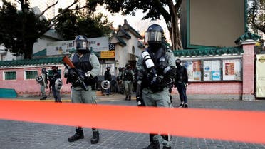 Riot police stand guard in Wong Tai Sin district, as protesters called for a general strike, in Hong Kong. (Reuters)