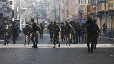 Israeli soldiers deploy doing clashes with Palestinians following a protest against U.S. President Donald Trump's decision to recognize Jerusalem as the capital of Israel in the West Bank city of Hebron, Friday, Dec. 15, 2017. (AP)