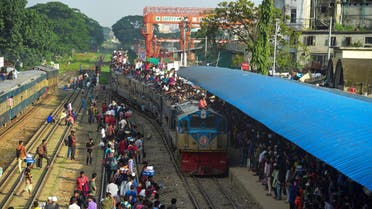 People cram onto a train to travel back home to be with their families ahead of the Muslim festival of Eid al-Adha, in Dhaka on August 9, 2019. (AFP)