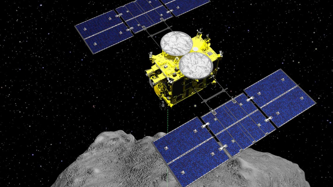 FILE - This computer graphics image released by the Japan Aerospace Exploration Agency (JAXA) shows the Hayabusa2 spacecraft above the asteroid Ryugu. Japan’s space agency JAXA said Thursday, July 11, 2019 that data transmitted from the Hayabusa2 indicated its second successful touchdown on the distant asteroid to complete a historic mission - to collect underground samples in hopes of finding clues to the origin of the solar system. (ISAS/JAXA via AP)