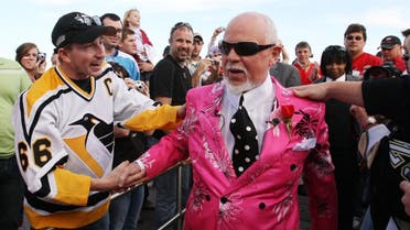 Don Cherry, announcer on CBC's "Hockey Night in Canada," is greeted by fans as he arrives for Game 2 of the NHL hockey Stanley Cup finals between the Pittsburgh Penguins and the Detroit Red Wings in Detroit, Sunday, May 31, 2009. (AP Photo/Carlos Osorio)