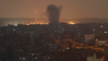 An explosion caused by Israeli airstrikes is seen in Gaza City, early Thursday. (AP)