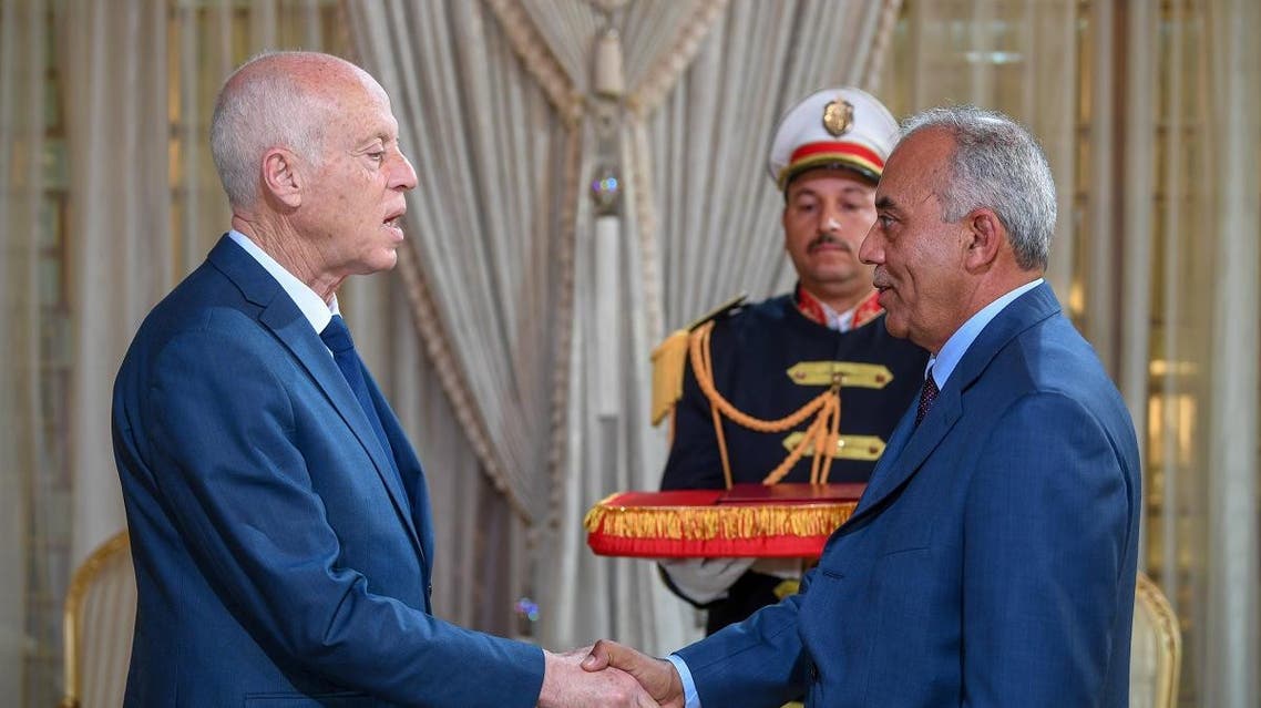 A handout picture provided by the Tunisian Presidency Press Service on November 15, 2019 shows Tunisia's President Kais Saied (L) receiving new Prime Minister Habib Jemli at the presidential palace. (AFP)