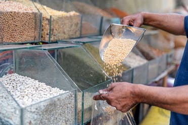 A merchant selling wheat seeds in a shop of Cairo, on June 27, 2019. (File photo: AFP)