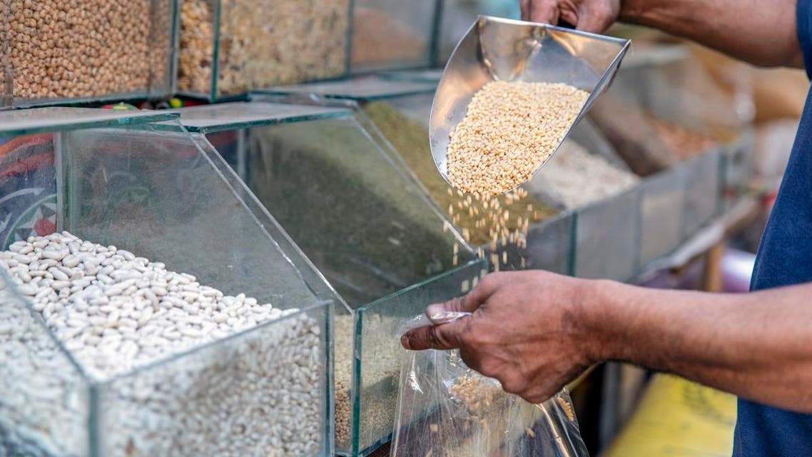A merchant selling wheat seeds in a shop of Cairo, on June 27, 2019. (File photo: AFP)