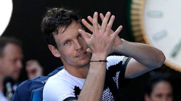 Tomas Berdych of the Czech Republic waves as he leaves Rod Laver Arena after his fourth round loss to Spain's Rafael Nadal at the Australian Open. (Reuters)