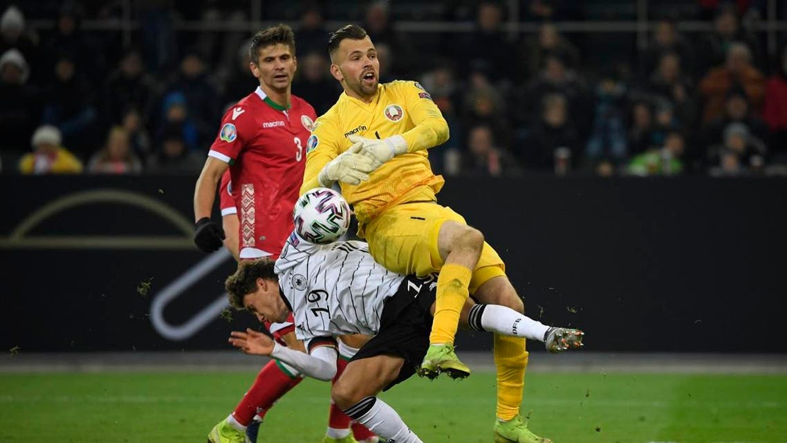 Belarus' goalkeeper Aleksandr Gutor and Germany's Luca Waldschmidt (L) vie for the ball during the UEFA Euro 2020 Group C qualification football match between Germany and Belarus, on November 16, 2019 in Moenchengladbach. (AFP)