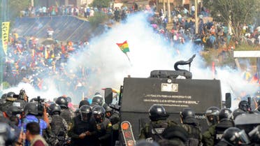 Bolivian riot police clash with supporters of Bolivia's ex-President Evo Morales during a protest against the interim government, in Sacaba, Chapare province, Cochabamba department on November 15, 2019. (AFP)