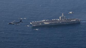 US aircraft carrier strike group sails through Strait of Hormuz