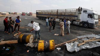 Anti-government protesters block Iraqi ports, threaten oil exports