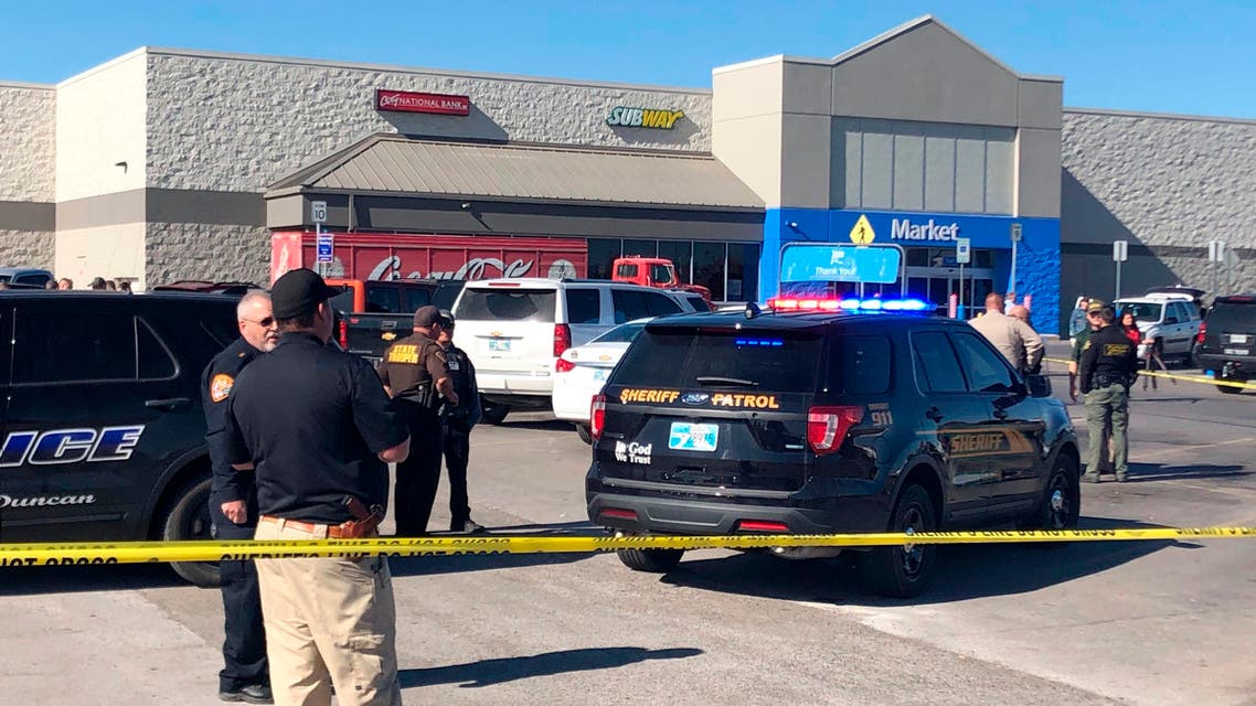 Law enforcement work the scene where two men and a woman were fatally shot on November 18, 2019, outside a Walmart store in Duncan, Oklahoma, in the US. (AP)