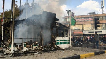 A police station that was set on fire during the protests - AFP