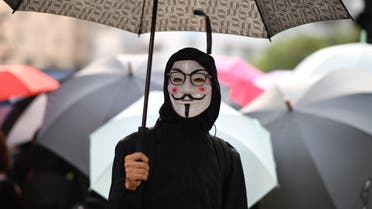 A demonstrator wearing a Guy Fawkes mask in Hong Kong, October 12 - AFP.jpg