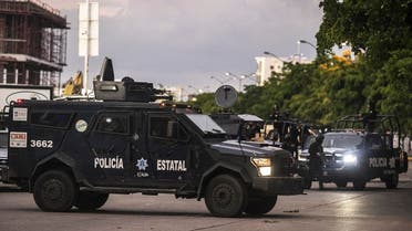 Mexican police patrol in a street of Culiacan, state of Sinaloa, Mexico. (AFP)