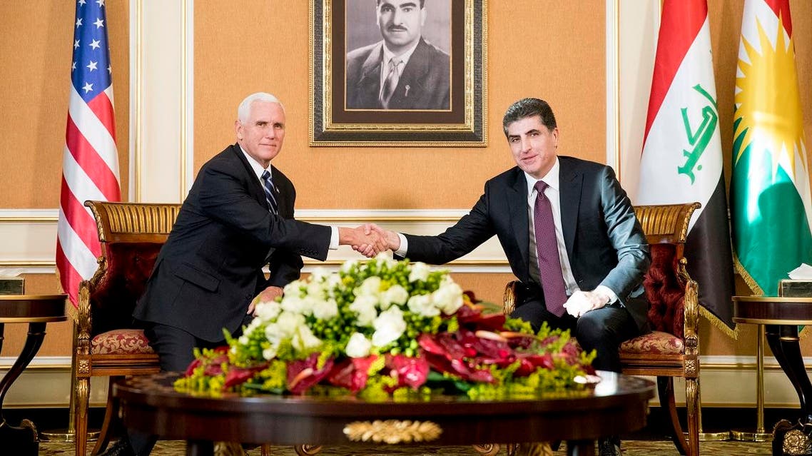 Vice President Mike Pence and Iraqi Kurdish Region President Nechirvan Barzani, right, shake hands during a bilateral meeting at Erbil International Airport in Erbil, Iraq, Saturday, Nov. 23, 2019. (AP)