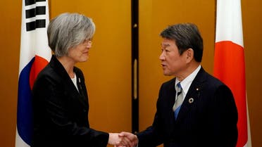 Japan's Foreign Minister Toshimitsu Motegi shakes hands with South Korea's Foreign Minister Kang Kyung-wha before the G20 foreign ministers meeting in Nagoya, Japan November 23, 2019. Eugene Hoshiko/Pool via REUTERS