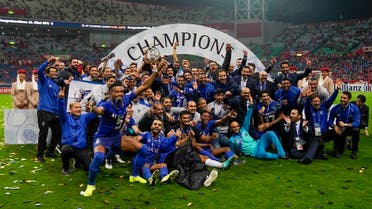 Al-Hilal team pose for the media after winning the second leg of the AFC Champions League final football match against Urawa Reds in Saitama, near Tokyo, Sunday, Nov. 24, 2019. (AP)