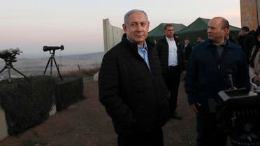 Netanyahu, center, and Defense Minister Naftali Bennett, visit an Israeli army base in the occupied Golan Heights on November 24, 2019. (AP)