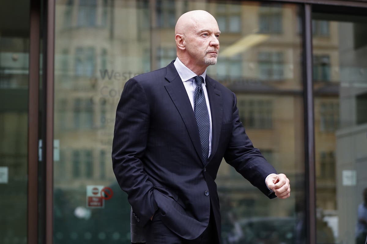 Former Barclays head of investment banking and investment management in the Middle East, Roger Jenkins, leaves after an appearance at Westminster Magistrates Court in central London on July 3, 2017. (AFP)