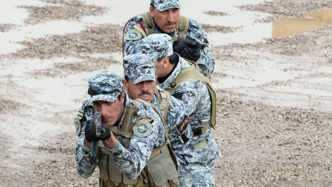 Iraqi policemen demonstrate combat techniques during a training session at Camp Dublin, Baghdad, Iraq, Wednesday , Nov. 25, 2009. (AP)