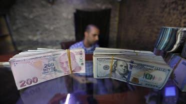 Reuters- Banknotes of U.S. dollars and Turkish lira are seen in a currency exchange shop in the city of Azaz