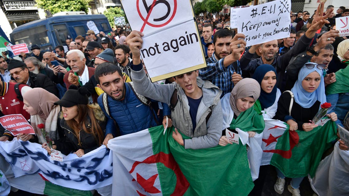AFP Algeria demonstrators chant slogans against the upcoming presidential election as they carry national flags during an anti-government protest in the center of the capital Algiers on November 26 2019