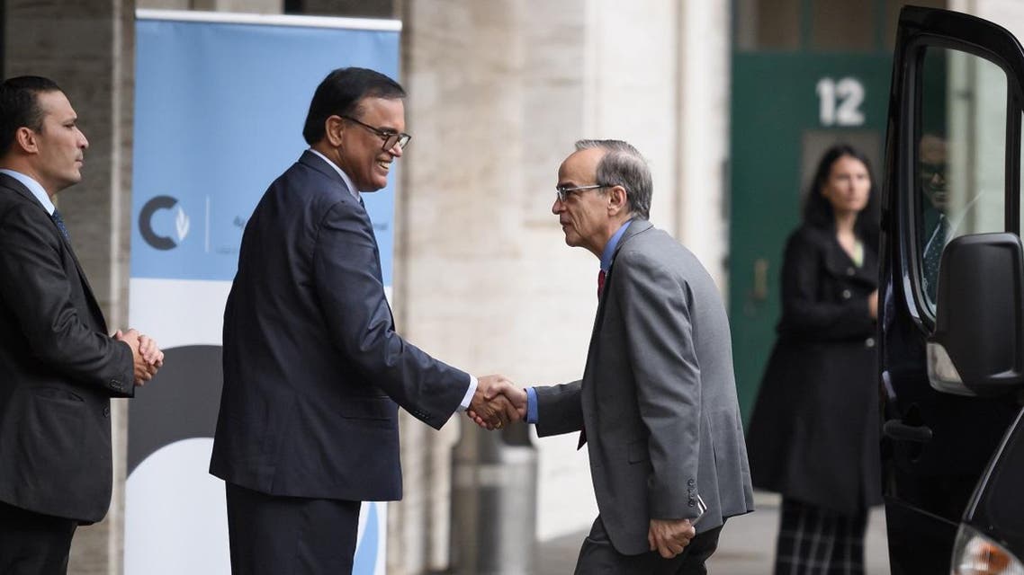 Co-chair and opposition Syrian Negotiations Commission head Hadi Al-Bahra (2nd R) is greeted upon his arrival for a new round of discussions of the Syria constitution-writing committee on November 25, 2019 at the United Nations Offices in Geneva. (AFP)