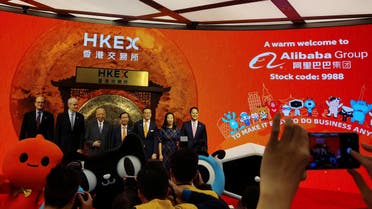 Reuters-Alibaba's Chairman and Chief Executive Officer Daniel Zhang, Vice Chairman Joseph Tsai and former Hong Kong chief executive Tung Chee-hwa attend Alibaba Group's listing ceremony at the Hong Kong Stock Exchange (HKEX) in Hong Kong, China