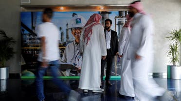 Reuters- People are seen before the start of a press conference by Aramco at the Plaza Conference Center in Dhahran