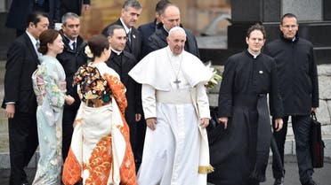 Pope Francis walks past women dressed in kimonos as leaves Tokyo's Haneda airport on November 26, 2019. (AFP)