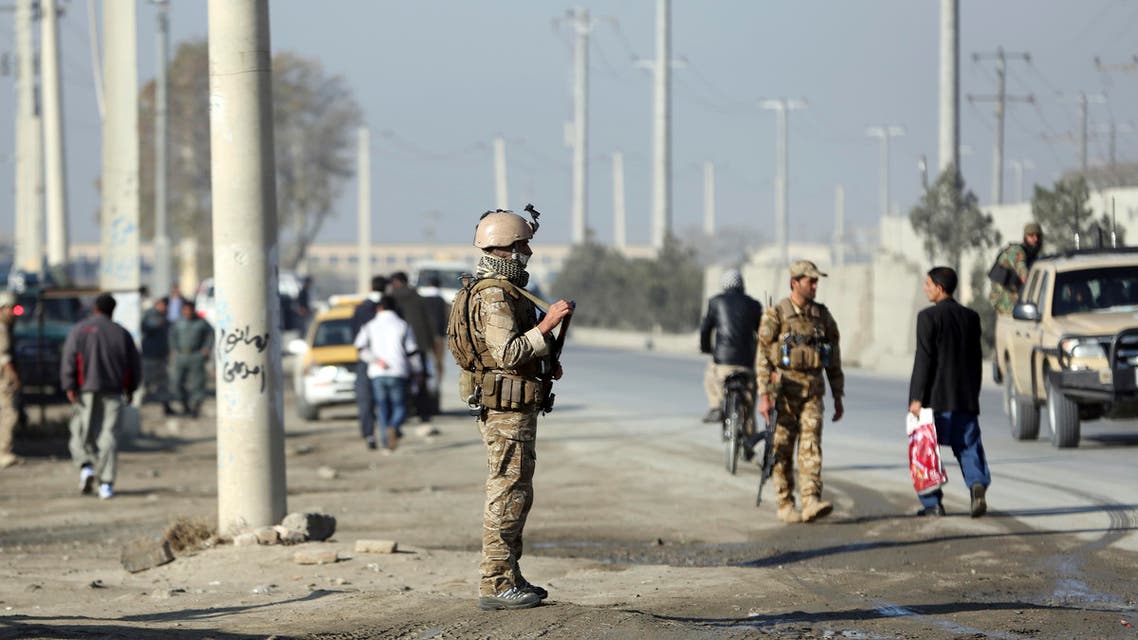 Afghan security personnel stand guard at the site of explosions in front of the Kabul Military Training Center in Kabul, Afghanistan, Monday, Nov. 18, 2019. (AP)