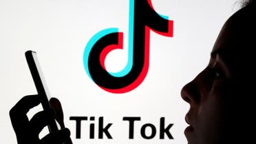 A person holds a smartphone with Tik Tok logo displayed in this picture illustration taken November 7, 2019. (Reuters)