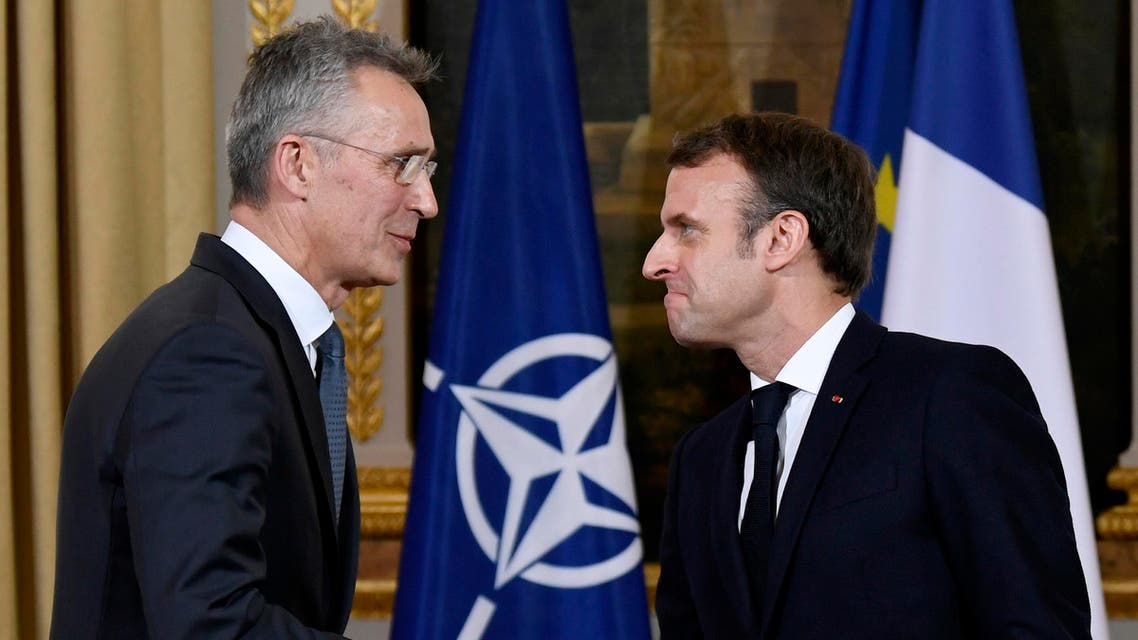 French President Emmanuel Macron (R) and NATO Secretary General Jens Stoltenberg shake hands after giving a press conference and holding a meeting at the Elysee palace in Paris on November 28, 2019. Bertrand GUAY / AFP
