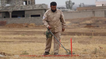 A member of the Mines Advisory Group (MAG) demining team searches for landmines in Khazer, Iraq, ON December 1, 2016. (Reuters)